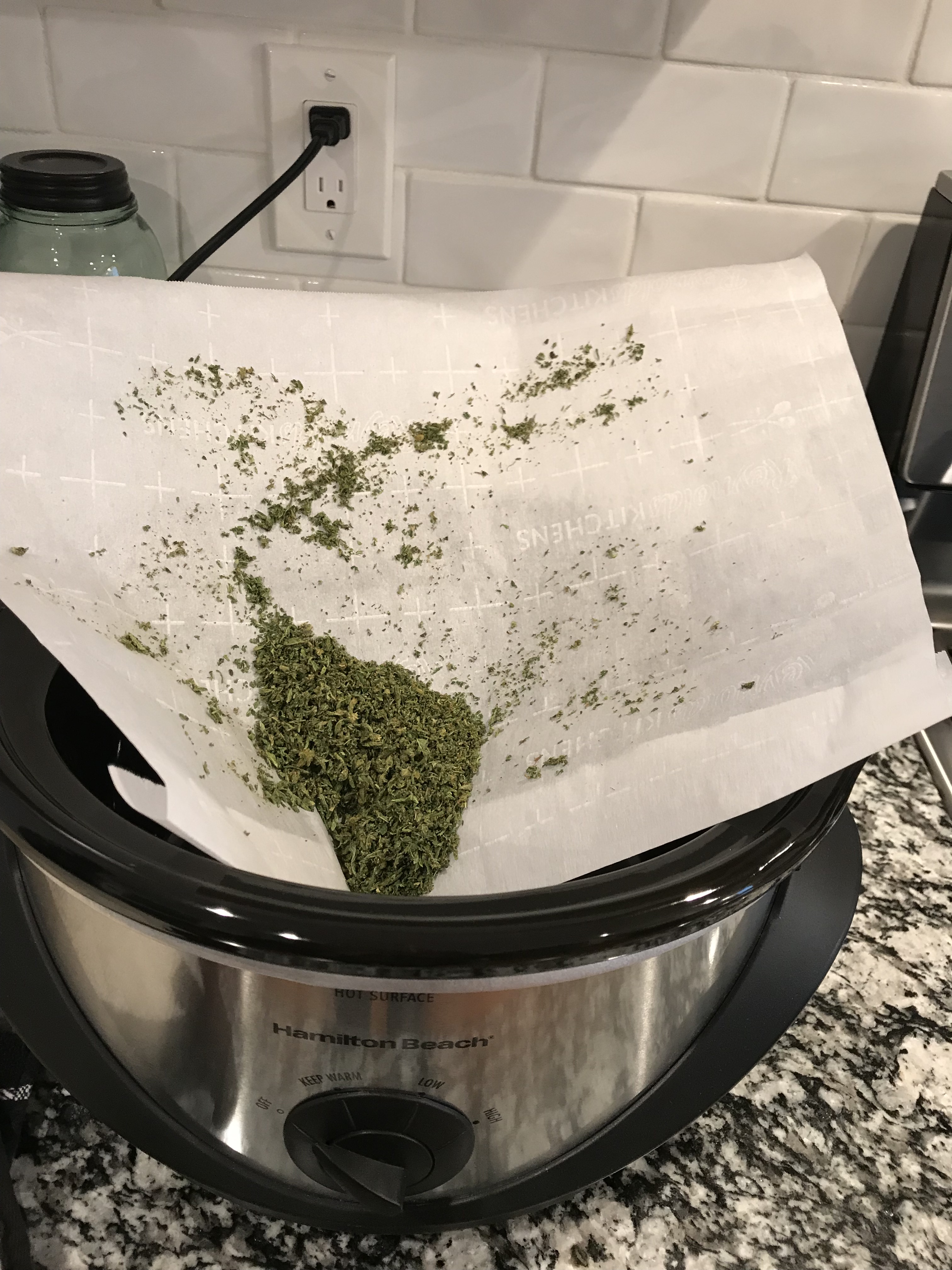 Easy does it! Gently pour all of the decarboxylated cannabis into the slow cooker, before you add the coconut oil.